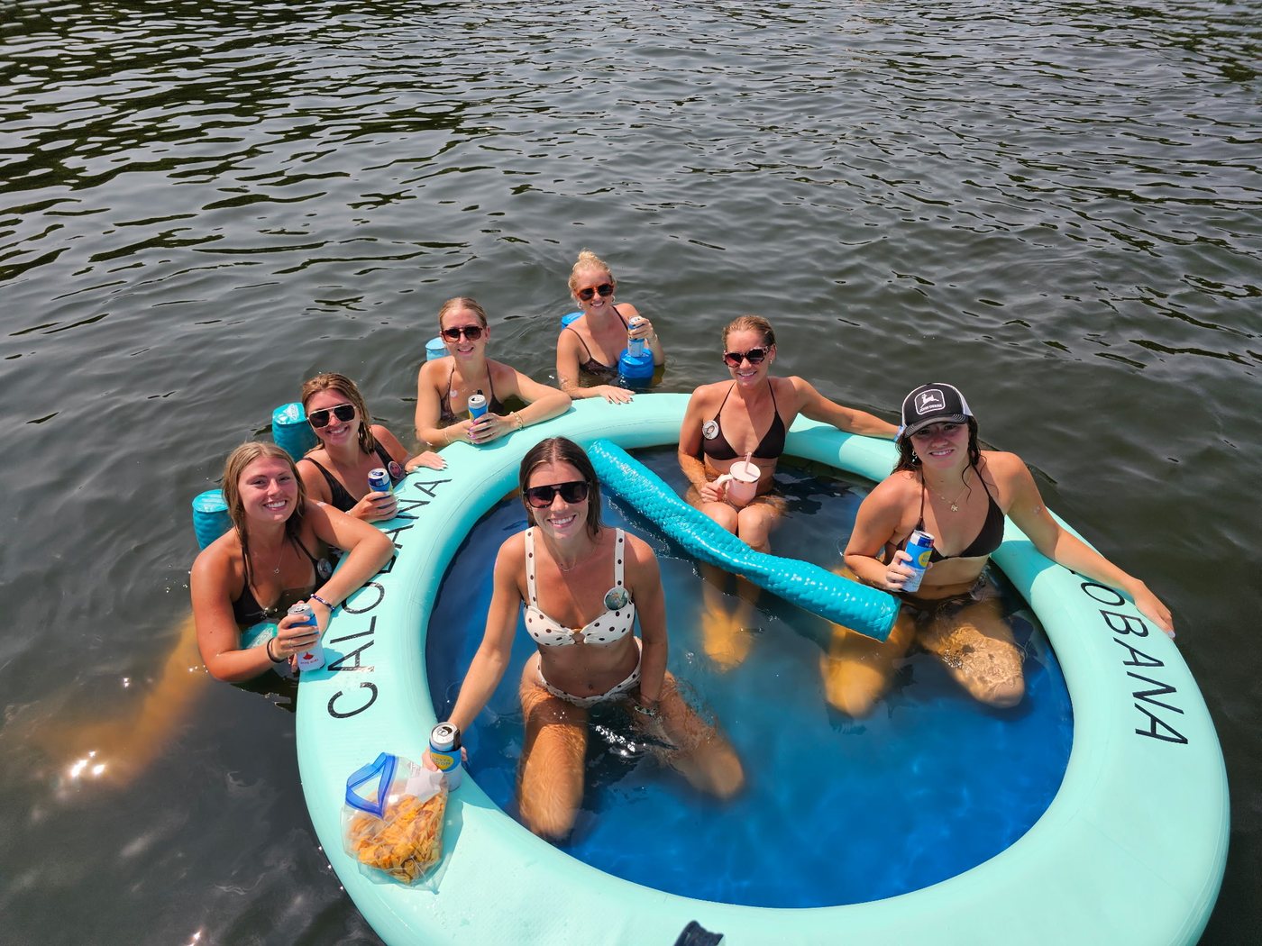 Guests relaxing on a floating mat